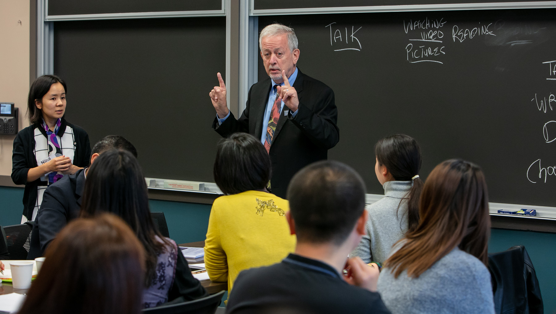 Paul Zionts demonstrates a learning technique that teachers from Beijing, China can implement during their own class lectures. (DePaul University/Randall Spriggs)